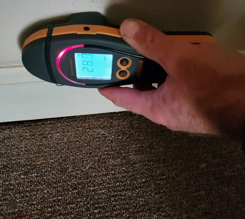 Moisture detection at baseboard during Storm Damage Restoration in Pleasant Run